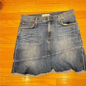 Blue denim skirt with distressed bottom